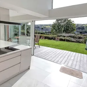 a modern kitchen with a large sliding glass door