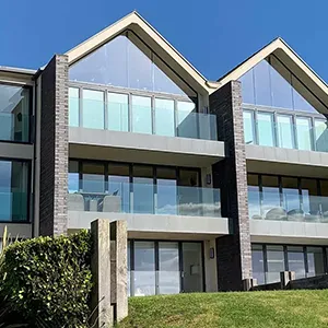 A large building with a lot of windows on the side of it.